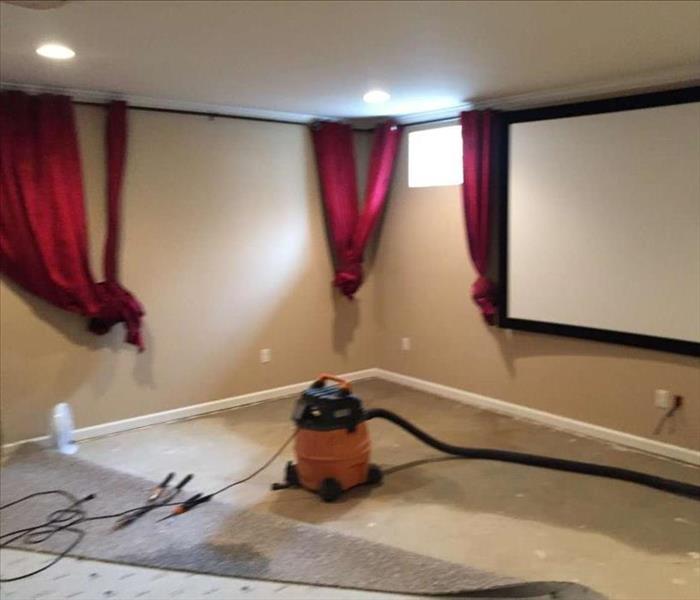 removing water from finished basement carpet