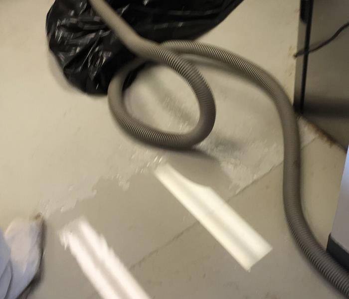 water on floor with equipment in photo