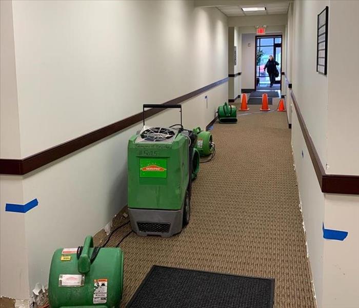 Using Drying Equipment For Water Damage in Commercial Building Hallway